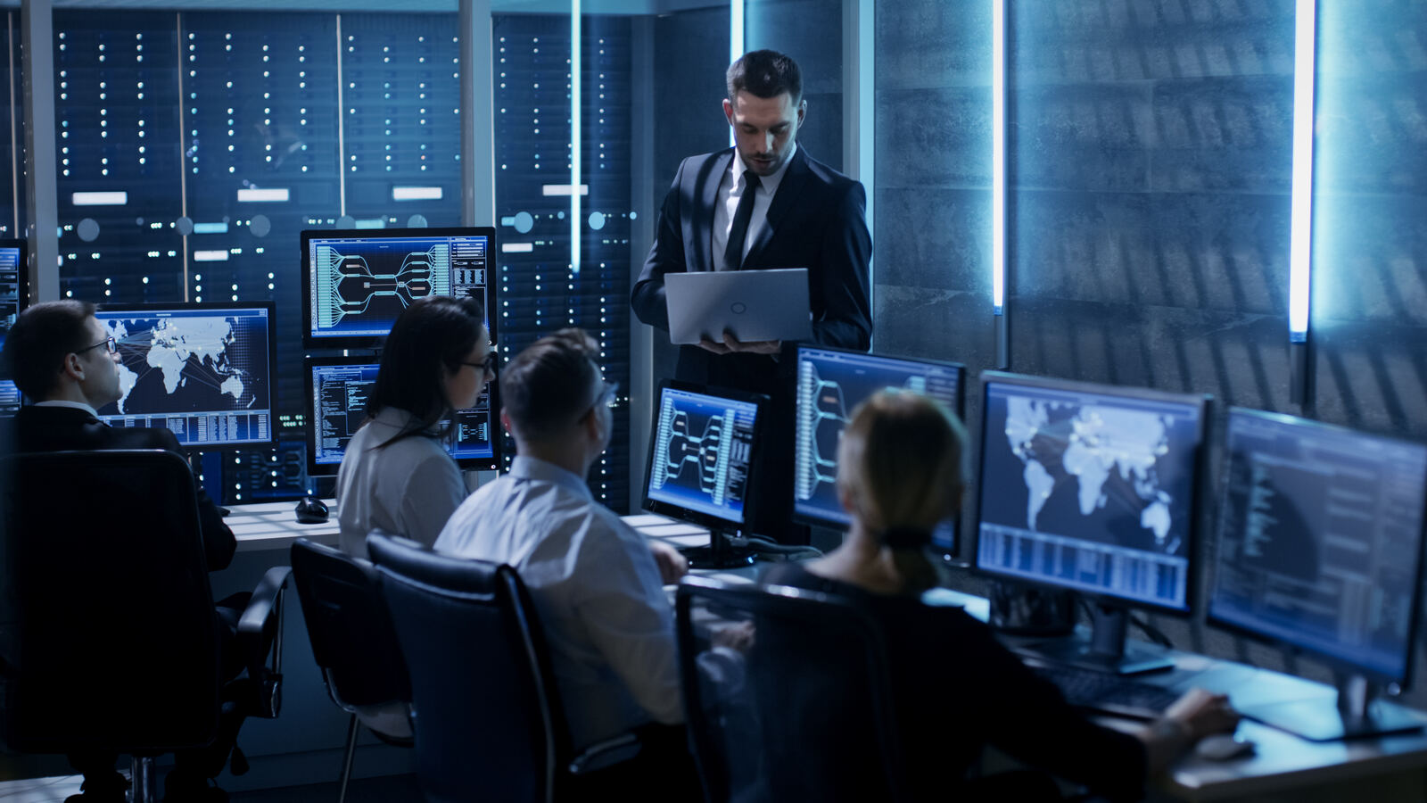 Operations team monitoring dashboards, representing audit logging