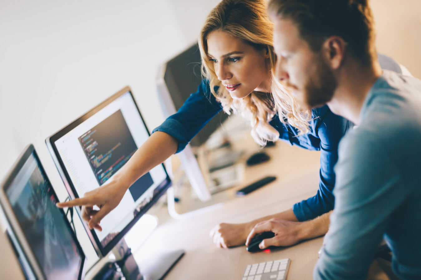 Team reviewing an agent dashboard on screen